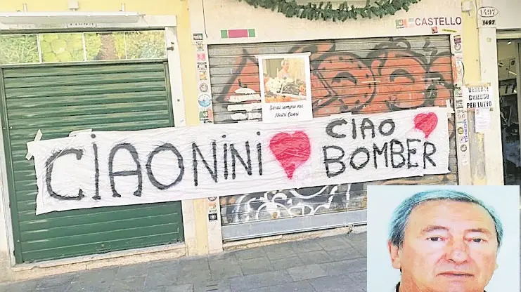 Lo striscione appeso sulla saracinesca dell'ortofrutta e Nini Zennaro