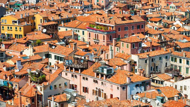 Venice roofs from above. Aerial view of houses, sea and palaces from San Marco tower