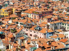 Venice roofs from above. Aerial view of houses, sea and palaces from San Marco tower