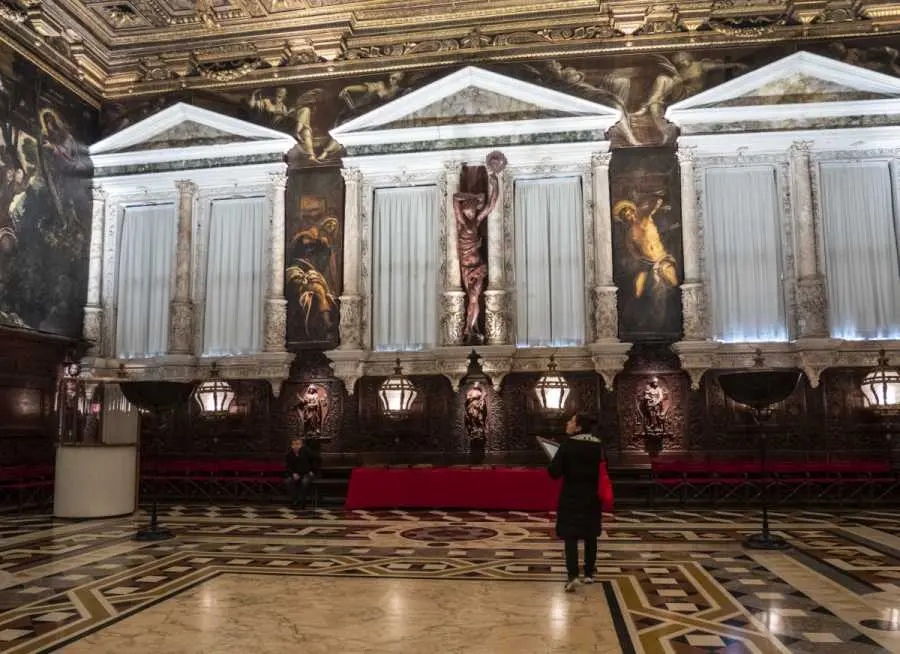 Italy, Veneto, Venice, Scuola Grande di San Rocco, tourists admire the works of Tintoretto in the school of the sacred Rochus