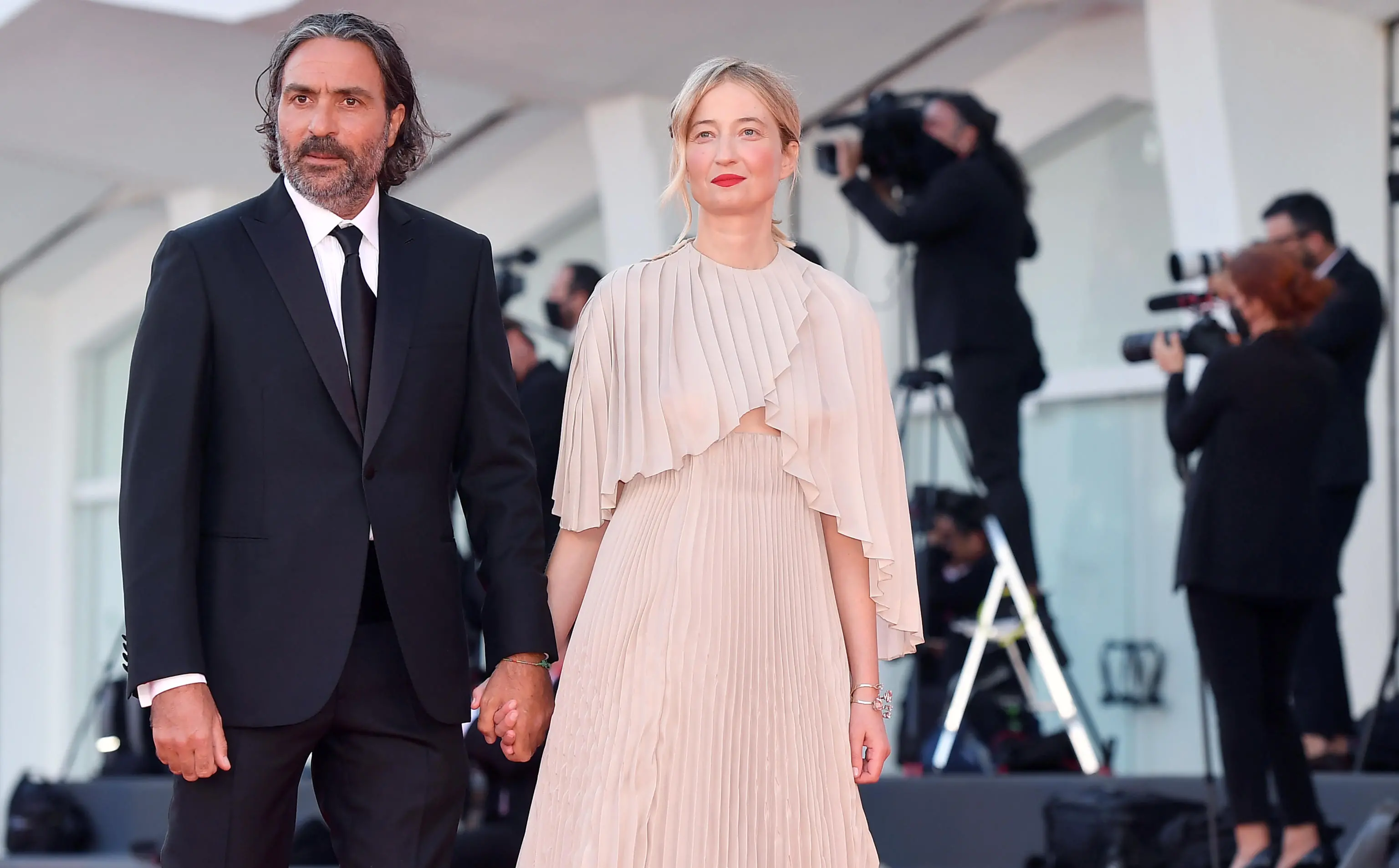 Italian director Saverio Costanzo (L) and Italian actress Alba Rohrwacher (R) arrive for the opening ceremony and screening of 'Madres paralelas' at the 78th annual Venice International Film Festival, in Venice, Italy, 01 September 2021 The movie is presented in the official competition 'Venezia 78' at the festival running from 01 to 11 September 2021. ANSA/ETTORE FERRARI