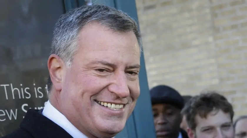 Democratic New York City mayoral candidate Bill de Blasio speaks to the media after greeting commuters at a subway stop in New York, Monday, Nov. 4, 2013. The mayoral election will take place on Tuesday, Nov. 5, 2013. (AP Photo/Seth Wenig)