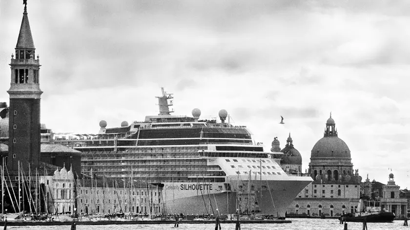 Venice, April 2013 - Big cruise liners invade the city - Celebrity Silhouette Solstice-class cruise ship passing by the old town >< Venezia, aprile 2013 - Le grandi navi da crociera invadono la città - La nave da crociera Celebrity Silhouette passa davanti al centro storico