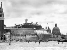 Venice, April 2013 - Big cruise liners invade the city - Celebrity Silhouette Solstice-class cruise ship passing by the old town >< Venezia, aprile 2013 - Le grandi navi da crociera invadono la città - La nave da crociera Celebrity Silhouette passa davanti al centro storico