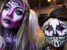 epa07133571 Costumed revellers attend Halloween celebrations in Lan Kwai Fong in Hong Kong, China, 31 October 2018. Halloween originated from ancient Celtic harvest festivals and is celebrated annually in several countries on 31 October. EPA/ALEX HOFFORD