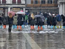 Domenica di pioggia e acqua alta