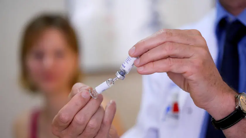 Woman receiving vaccination at the yellow fever vaccination center of the Cochin Saint-Vincent-de-Paul hospital, Paris, France.