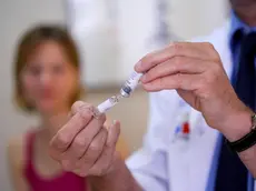 Woman receiving vaccination at the yellow fever vaccination center of the Cochin Saint-Vincent-de-Paul hospital, Paris, France.