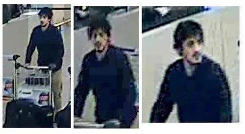 A handout image provided by Belgian Federal Police shows a CCTV grab of one of the three suspects in the Zaventem airport attack in Brussels, Belgium, 22 March 2016. A surveillance camera at Zaventem airport in Brussels captured footage of the alleged perpetrators of the explosions that took place earlier the day. It reveals two men dressed in black and both wearing one glove on their left hand, which according to La Libre Belgique could have served to conceal the detonators. The third (not pictured), dressed in a white jacket and wearing a black hat, is being 'actively pursued' in the meantime, according to Belgian newspapers. ANSA/BELGIAN FEDERAL POLICE / HANDOUT BEST QUALITY AVAILABLE HANDOUT EDITORIAL USE ONLY/NO SALES