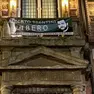 Lo striscione sul municipio di Bologna
