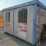 Le scritte sul container del cantiere per il nuovo asilo nido di Sottomarina