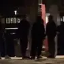 Un frame del video in cui si vede il giovane accerchiato da alcuni connazionali prima di cadere in acqua e annegare