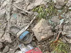 I resti degli effetti personali dei tre braccianti morti a Ca' Lino