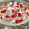 Una pizza postata sui profili social del locale vandalizzato