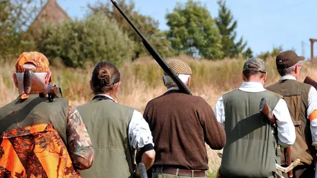 Hunters walk through fields, on September 16, 2012, in Godewaersvelde, at the first day of the hunting season in Northern France. With 1.3 million of hunters, France remains the first country in Europe for wildlife management ahead of Spain and Italy. AFP PHOTO / PHILIPPE HUGUEN (Photo credit should read PHILIPPE HUGUEN/AFP/GettyImages)