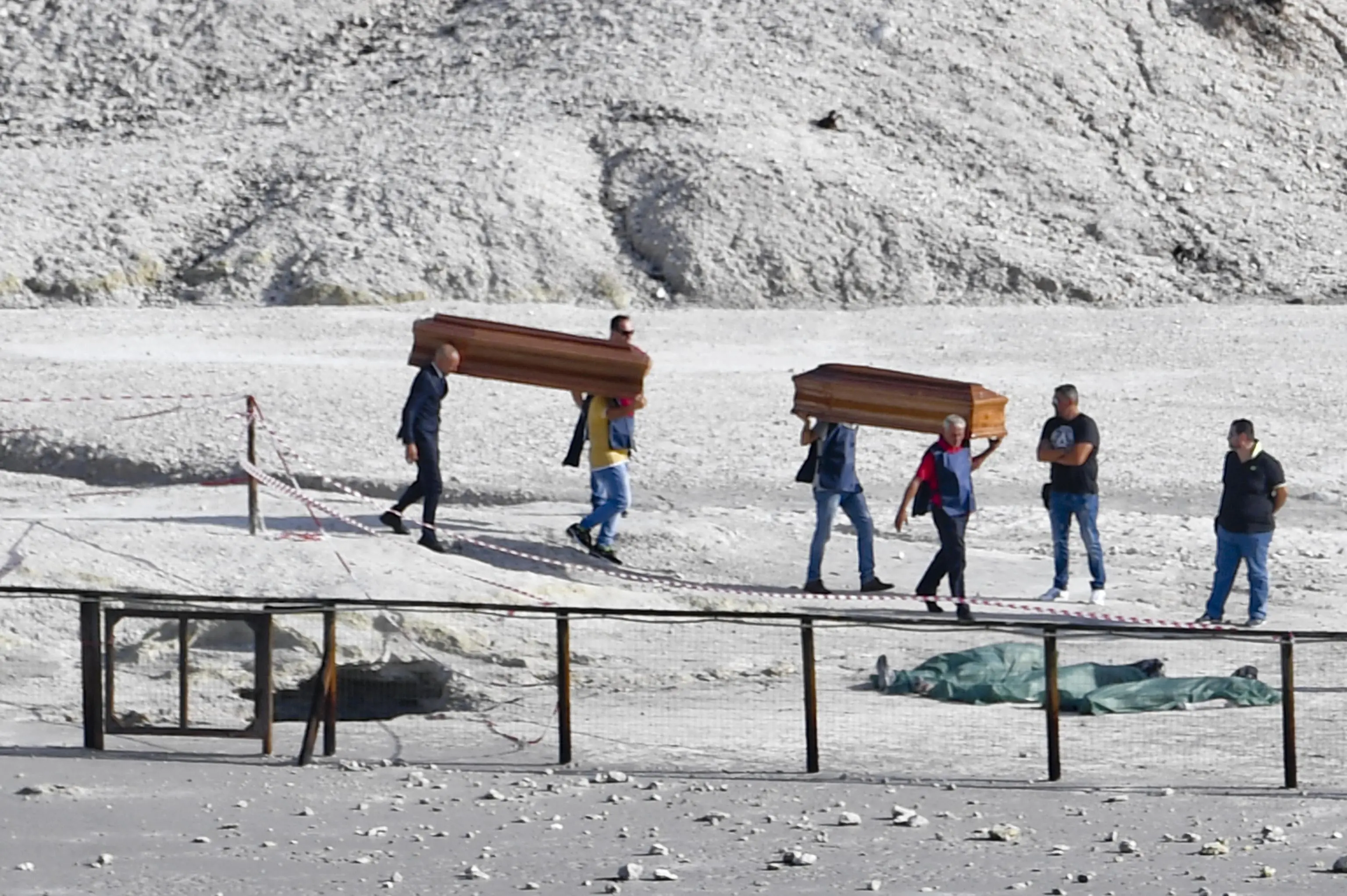 The coffins of three people dead in the Solfatara at Pozzuoli, near Naples, carried away out of the the volcanic zone. A couple and an 11-year-old boy have died and another child, aged seven, survived, Police said. The woman was 42 and the man was 45. Naples, Italy, 12 September 2017..ANSA/ CIRO FUSCO