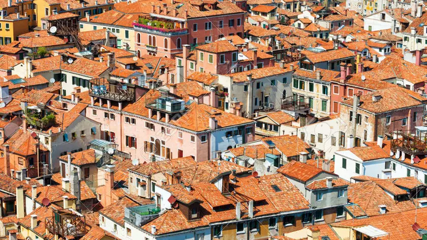 Venice roofs from above. Aerial view of houses, sea and palaces from San Marco tower