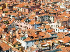 Venice roofs from above. Aerial view of houses, sea and palaces from San Marco tower