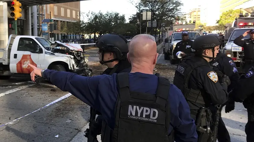 New York City Police Officers respond to report of gunfire along West Street near the pedestrian bridge at Stuyvesant High School in lower Manhattan in New York, Tuesday, Oct. 31, 2017. (Martin Speechley/NYPD via AP)