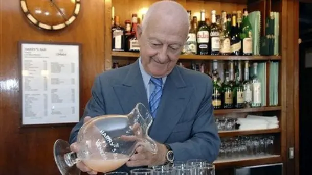 Arrigo Cipriani, owner of Harry's Bar, pours the bar's famous Bellini drink in his bar in Venice, northern Italy, in this June 16, 2006 photo made available Monday, April 7, 2008. Ernest Hemingway didn't have to worry about a strong euro, but Americans in Venice these days do, so the novelist's old haunt is giving U.S. tourists 20 percent off. The classy, pricey restaurant near St. Mark's Square was sporting a sign Monday, April 7, 2008, telling Americans they'll get the discount on all the items on the menu. The notice cites Americans' economic woes linked to the subprime loan crisis. (AP Photo/Luigi Costantini)