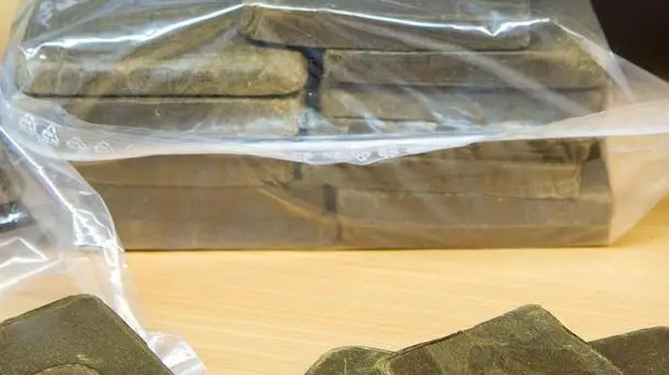 epa04469854 The German prosecution presents hashish during a press conference in the police headquarters in Pirmasens, Germany, 30 October 2014. A German-Spanish investigative team could assure the drugs against an international operating smuggling organisation. EPA/OLIVER DIETZE