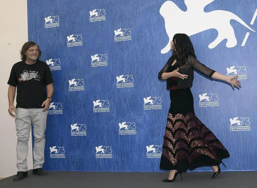 Italian actress Monica Bellucci (R) and Bosnian film maker Emir Kusturica (L)pose during a photocall for 'Na Mlijecnom Putu' (On the Milky Road) during the 73rd Venice Film Festival in Venice, Italy, 09 September 2016. The movie is presented in the Official competition 'Venezia 73' at the festival running from 31 August to 10 September. ANSA/CLAUDIO ONORATI