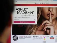 FILE - In this June 10, 2015 photo, Ashley Madison's Korean website is shown on a computer screen in Seoul, South Korea. Hackers claim to have leaked a massive database of users from Ashley Madison, a matchmaking website for cheating spouses. In a statement released Tuesday, Aug. 18, a group calling itself Impact Team said the site's owners had not bowed to their demands. (AP Photo/Lee Jin-man, File)