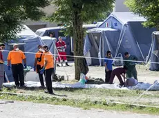 The bodies of some victims lie in the ground for the recognition by the family, in Amatrice on 25 August 2016. ANSA/MASSIMO PERCOSSI