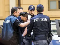 I due ragazzi, ricercati per l'incidente avvenuto la scorsa settimana alla periferia di Roma dove ha perso la vita una donna filippina e 8 persone sono rimaste ferite, fermati dalle forze di Polizia, Roma, 1 giugno 2015. I due ragazzi rischiano l'accusa di omicidio volontario. ANSA/MASSIMO PERCOSSI