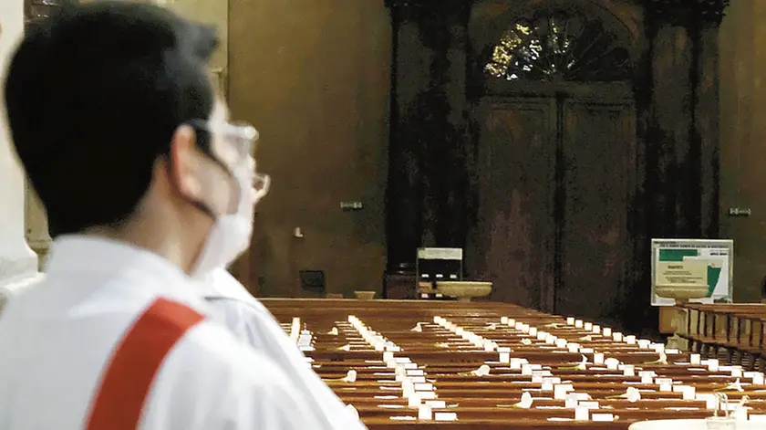 A long list that will be punctuated during the mass broadcast live on Facebook, 03 May 2020. Thus in Manerbio, a town near Brescia (Italy), the parish priest Don Tuccinardi wants to remember the dead from January 1st. These are 150 names that have been written on the church benches, one next to the other and that the priest will read in an empty church without faithful because of the restrictions for the containment of the spread of the Coronavirus Covid-19. ANSA/FILIPPO VENEZIA