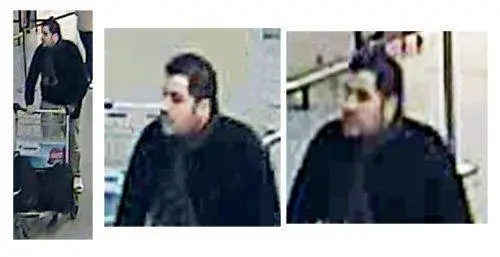 epa05226545 A handout image provided by Belgian Federal Police shows a CCTV grab of one of the three suspects in the Zaventem airport attack in Brussels, Belgium, 22 March 2016. A surveillance camera at Zaventem airport in Brussels captured footage of the alleged perpetrators of the explosions that took place earlier the day. It reveals two men dressed in black and both wearing one glove on their left hand, which according to La Libre Belgique could have served to conceal the detonators. The third (not pictured), dressed in a white jacket and wearing a black hat, is being 'actively pursued' in the meantime, according to Belgian newspapers. EPA/BELGIAN FEDERAL POLICE / HANDOUT BEST QUALITY AVAILABLE HANDOUT EDITORIAL USE ONLY/NO SALES