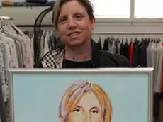 I commercianti di corso del popolo con i quadri che li raffigurano nella foto: Leonilde Facchin di Moda Donna