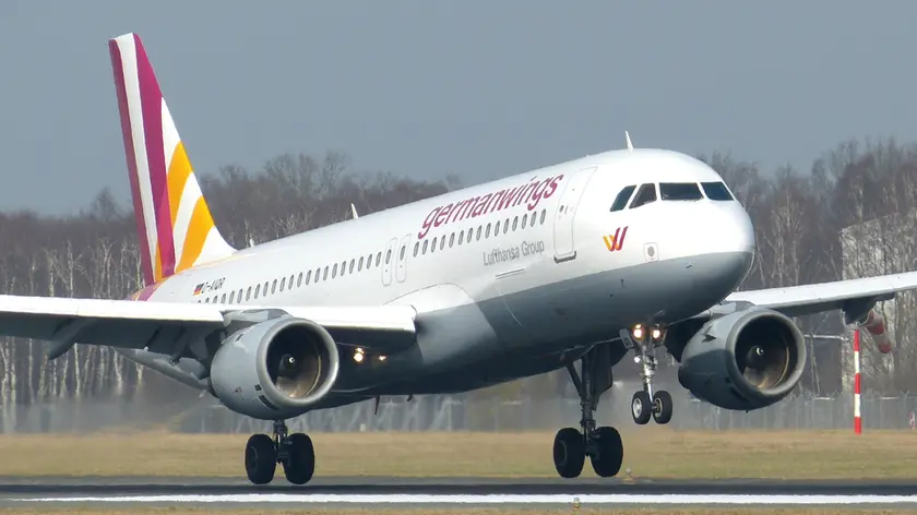 The March 7, 2014 photo shows an Airbus A320 of German airline Germanwings as it lands at the airport in Hamburg, northern Germany. A Germanwings passenger jet carrying 148 people crashed in the French Alps region as it traveled from Barcelona to Duesseldorf Tuesday, March 24, 2015. (AP Photo/dpa, Jan-Arwed Richter)