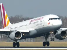 The March 7, 2014 photo shows an Airbus A320 of German airline Germanwings as it lands at the airport in Hamburg, northern Germany. A Germanwings passenger jet carrying 148 people crashed in the French Alps region as it traveled from Barcelona to Duesseldorf Tuesday, March 24, 2015. (AP Photo/dpa, Jan-Arwed Richter)