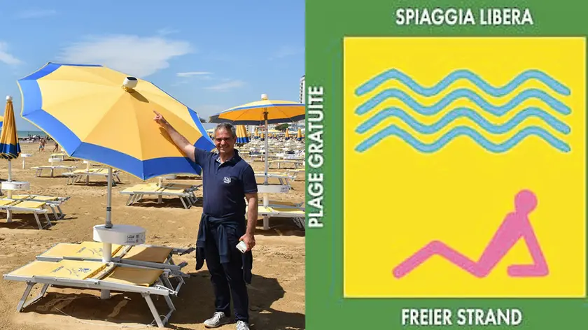 SCATTOLIN - TOMMASELLA - JESOLO - LA SPIAGGIA LIBERA NON ORGANIZZATA DELLA ZONA DEL FAROCHRISTIAN TERZARIOL MOSTRA IL SENSORE PER L'APERTURA AUTOMATICA DELL'OMBRELLONE