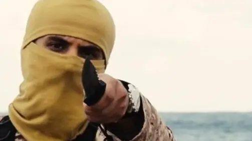 Un frame del video dell'Isis pubblicato dal sito Site dal titolo "Un messaggio firmato con il sangue alla Nazione della Croce", che mostra la decapitazione "di decine" di persone in Libia, 15 febbraio 2015. ANSA/SITE ++ NO SALES, EDITORIAL USE ONLY ++