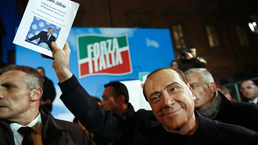 Italy's former Prime Minister Silvio Berlusconi after a speech outside Palazzo Grazioli, his private residence, in Rome, 27 November 2013. Italy's parliament prepared to expel Silvio Berlusconi today over his tax fraud conviction in a momentous move that raises the risk of his arrest but is unlikely to end his tumultuous career. Thousands of Berlusconi loyalists massed outside the three-time former prime minister's luxury home in Rome to support their leader, as lawmakers from his party took the floor of the Senate one by one to back him. ANSA/GUIDO MONTANI