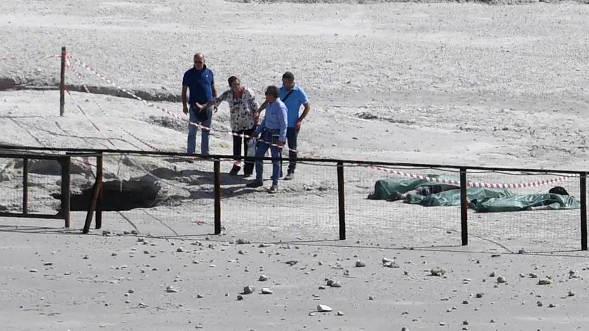The coffin of three people died in the crater stand under the green cloth at Pozzuoli, Naples, Italy, 12 settembre 2017. A couple and an 11-year-old boy have died at the Solfatara volcanic crater at Pozzuoli, near Naples, police said on Tuesday. Another child, aged seven, survived, the sources said. The woman was 42 and the man was 45. ANSA/CIRO FUSCO