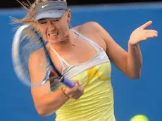 epa03538295 Maria Sharapova of Russia in action during her match against Misaki Doi of Japan, in round two of the Australian Open tennis tournament in Melbourne, Australia, 16 January 2013. EPA/JULIAN SMITH AUSTRALIA AND NEW ZEALAND OUT
