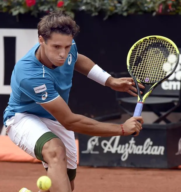 Italian Filippo Baldi returns the ball to Georgian Nikoloz Basilashvili during their first round match of the Italian Open tennis tournament at the Foro Italico in Rome, Italy, 15 May 2018. ANSA/CLAUDIO ONORATI