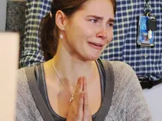 epa03640831 (FILES) A file photo dated 4 October 2011 of US student Amanda Knox reacting as she addresses media after arriving at the Sea-Tac Airport in Seattle, Washington, USA, a day after her release from prison in Italy. The Italian high court ruled 26 March 2013 that she is to face a retrial following a challenge by the prosecution. The Court of Cessations ruled to overturn the acquittal of Knox and Raffaele Sollecito for the 2007 murder of Meredith Kercher in Perugia EPA/DAN LEVINE