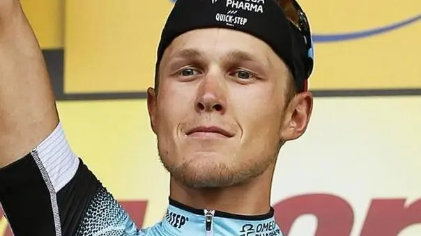 epa03786815 Italian rider Matteo Trentin of the Omega Pharma Quick Step procycling team celebrates on the podium after winning the 14th stage of the 100th edition of the Tour de France 2013 cycling race between Saint-Pourcain-Sur-Sioule and Lyon, France, 13 July 2013. EPA/YOAN VALAT