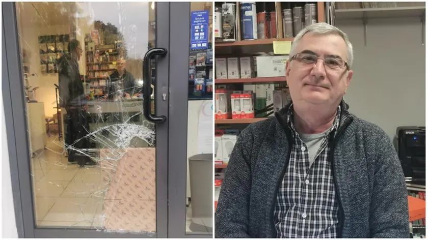 La porta sfondata da Compel elettronica e il titolare Diego Zurlandi (foto Marta Artico)